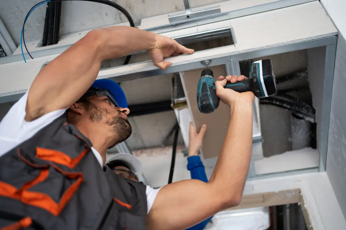 HVAC design engineer reviewing a commercial air-conditioning layout