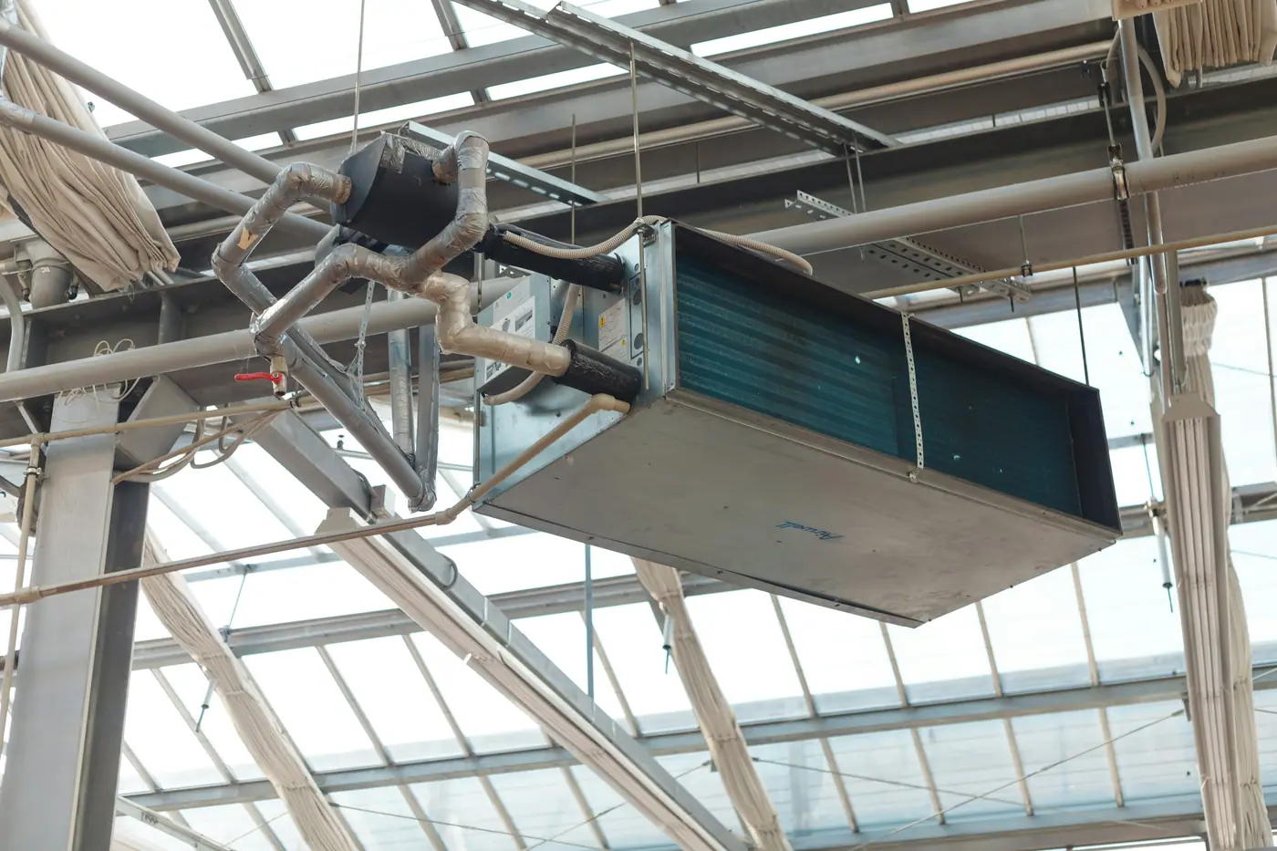 Ventilation unit with connected GI ductwork on a commercial site